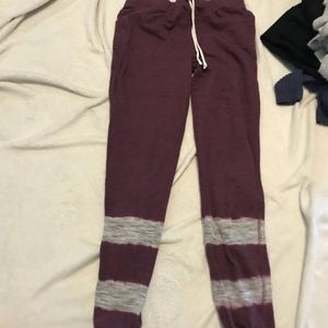 Maroon sweatpants.
